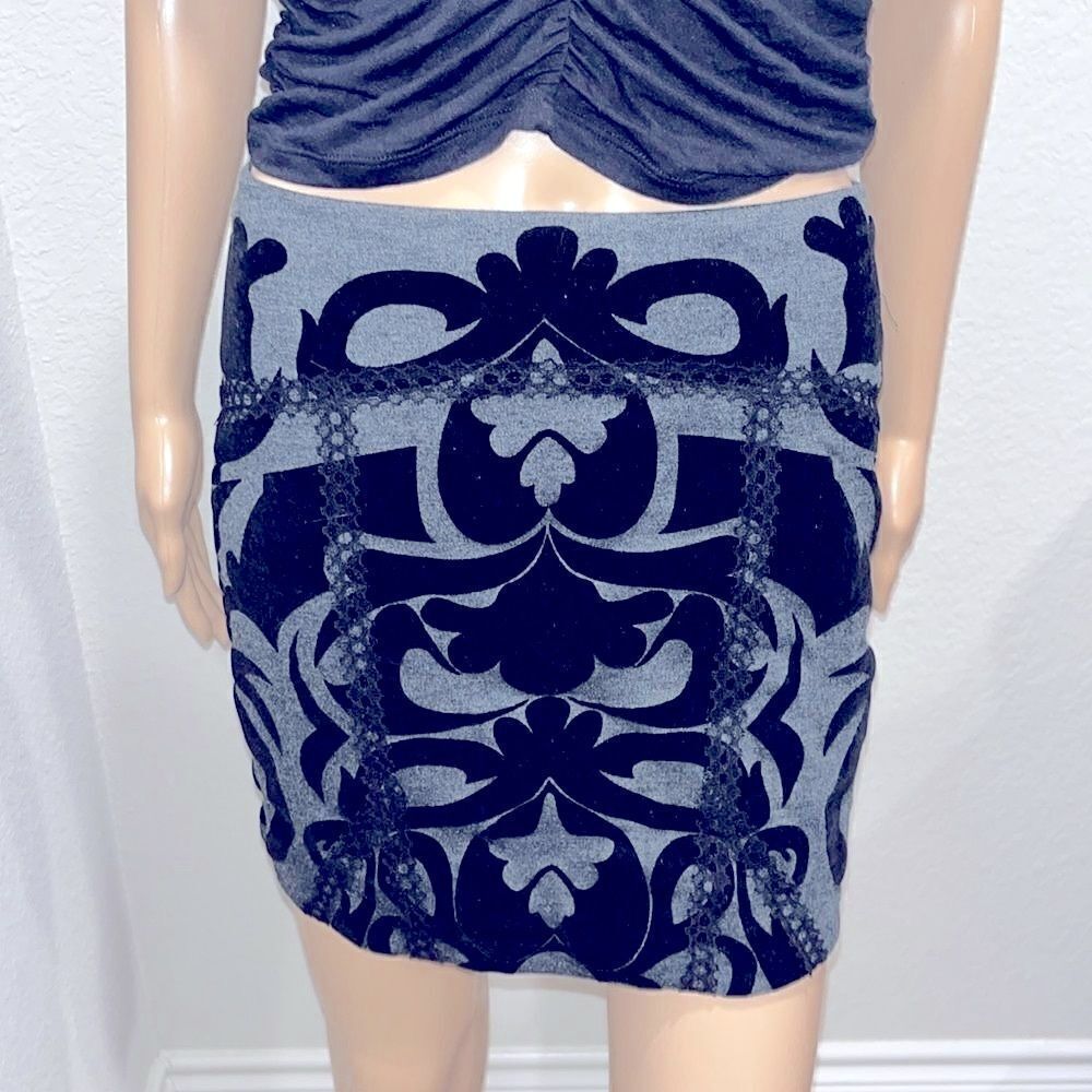 Free People  textured geometrical mini skirt 70% polyester 25% rayon,5% spandex.